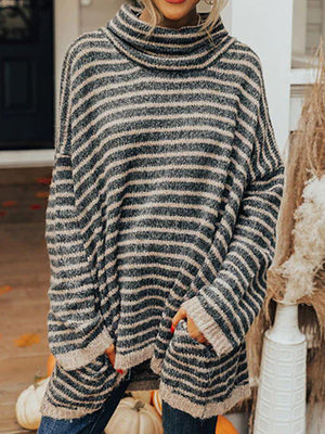 Oversized striped turtleneck sweater with slouch pockets in black and tan.