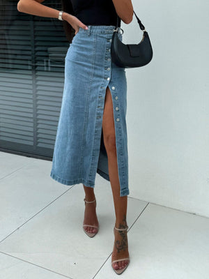 Button-front denim midi skirt in light wash with a high slit and silver buttons.