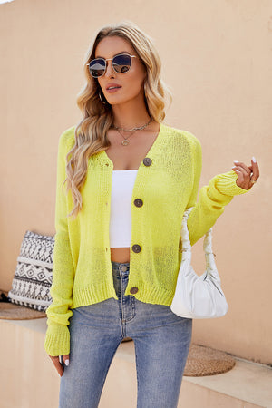 Banana Yellow raglan sleeve button-up knit cardigan with wooden buttons.