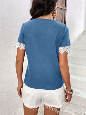 Cerulean waffle knit henley with lace trim short sleeves and button detail.