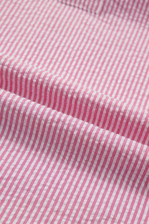 Pink and white striped textured polyester short sleeve blouse fabric detail