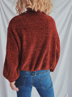 Terracotta textured ribbed knit relaxed crewneck pullover sweater with balloon sleeves.