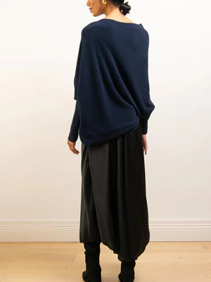 Dark blue off-shoulder drape knit sweater with textured cuffs and batwing sleeves.