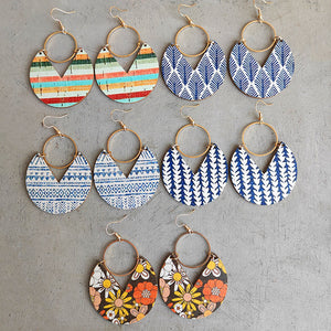 Geometric striped wood drop earrings in multiple patterns and colors, including floral and tribal prints.
