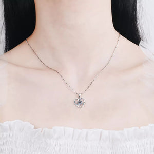 Silver heart-shaped zircon pendant necklace with delicate chain.