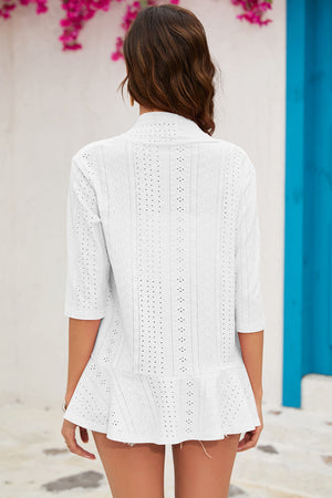 White perforated ruffle hem cardigan with 3/4 sleeves and eyelet details.