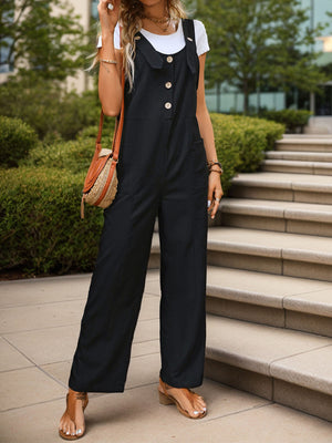 Black button-front wide-leg jumpsuit with pockets, styled with a white tee and sandals.