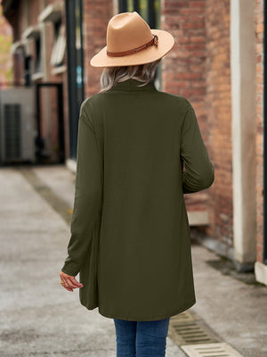 Moss green draped cascade cardigan with long sleeves and open front, styled with a hat.