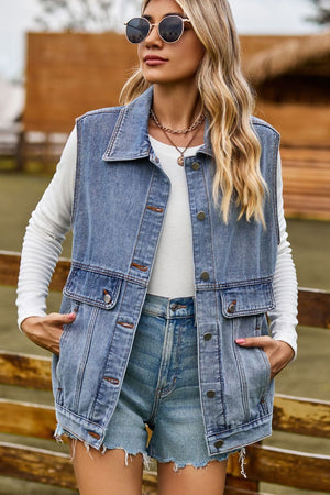 Sleeveless light wash denim utility vest with buttoned pockets and collar.