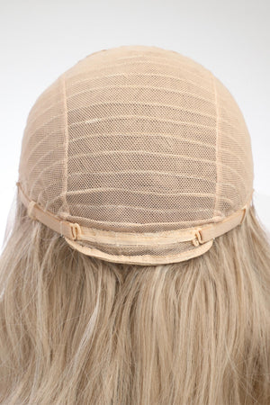 Blonde lace front wig cap construction with adjustable straps and blonde wavy hair