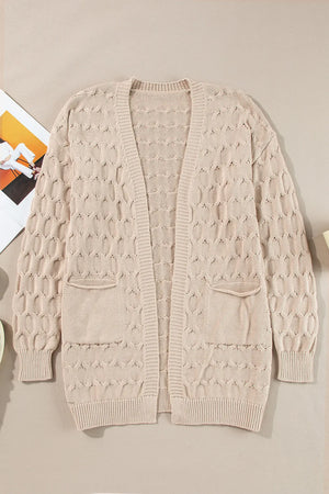 Textured cable knit open cardigan in dust storm with two front pockets.