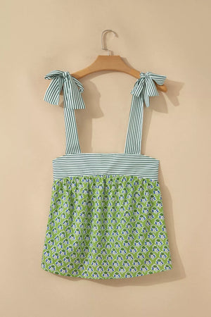 Floral tie-strap tank top with square neckline and green floral print.