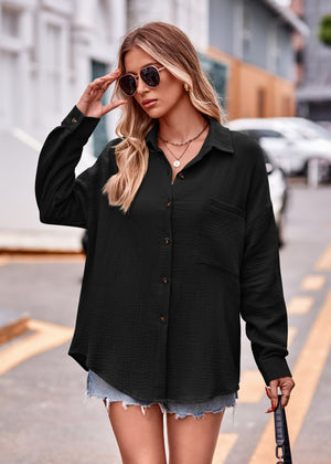 Black textured gauze overshirt with relaxed silhouette, button front, and chest pocket.