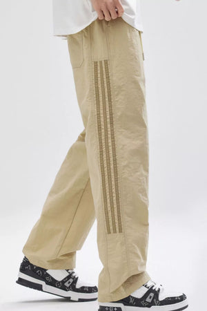 Khaki sweatpants with side stripe detail and drawstring waist