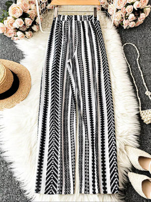 Black and white geometric print wide-leg maternity pants with a bow detail.