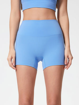 Light Blue Nova Rise High-Motion Shorts with seamless waistband and mid-thigh length.