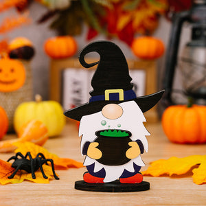 Halloween gnome figurine in Style A with black hat, holding cauldron, surrounded by pumpkins and leaves.