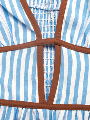 Blue striped halter maxi dress with smocked bodice and brown trim detail.