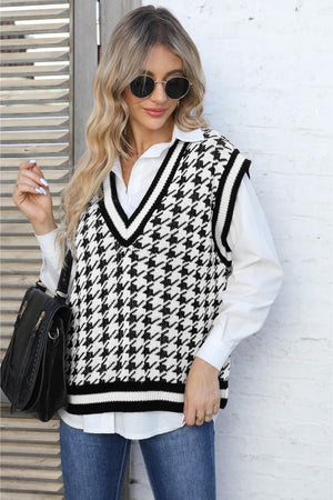 Houndstooth knit vest with V-neck and contrast trim, styled over a white shirt.