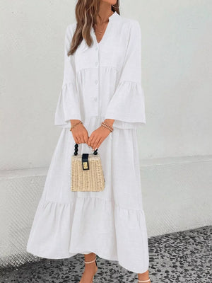 White tiered ruffle hem v-neck dress with button front and bell sleeves.