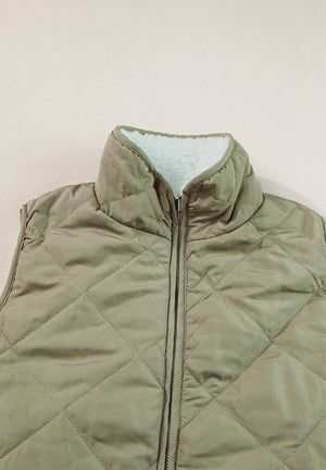 Quilted sherpa-lined utility vest in sage with a stand collar and zip front.