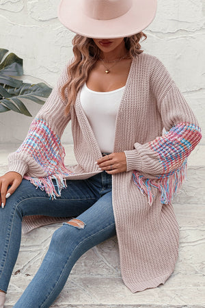 Textured sleeve fringe cardigan in acrylic with colorful plaid detail and fringe trim.