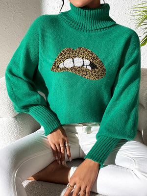 Green turtleneck sweater with sequin lip detail and balloon sleeves