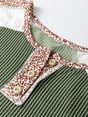 Dark green waffle knit henley top with leopard print trim and lace details.
