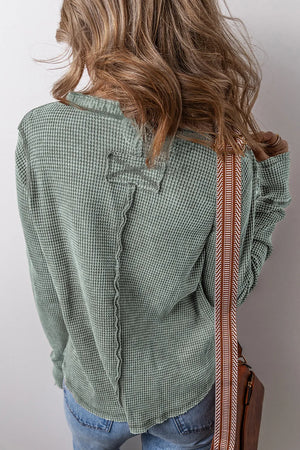 Sage waffle knit long sleeve blouse with contrast stitching detail and decorative back yoke.