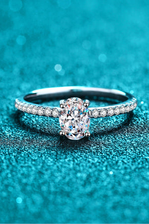 Silver oval moissanite ring with pavé band