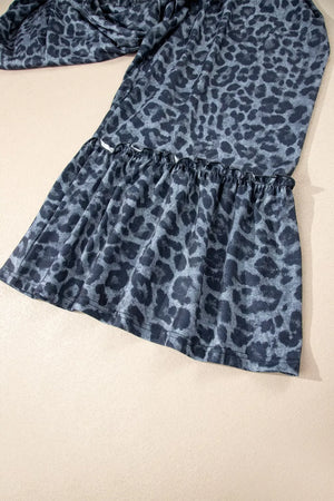 Maternity pants in dark navy with leopard print and ruffled hem detail.