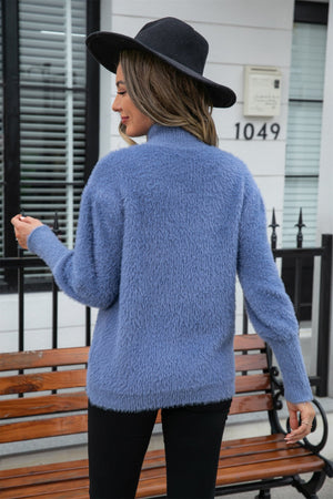 Fluffy mock neck sweater in Dusty Blue with balloon sleeves.