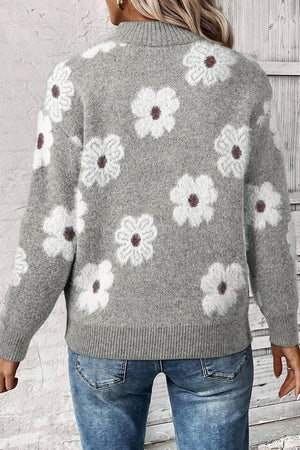 Gray acrylic sweater with white floral intarsia pattern and mock neck.