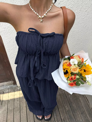 Navy ruffled peplum tube top and wide-leg pants set with drawstring detail