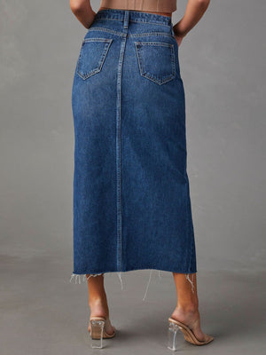 Denim midi skirt in dark wash with raw hem and buttoned closure.