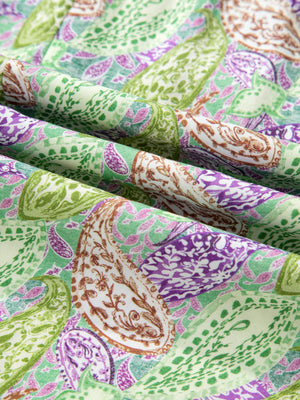 Paisley print blouse in cream with green and purple accents, featuring puff sleeves.