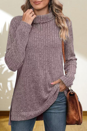 Ribbed knit turtleneck tunic top in lavender with long sleeves and side slits.