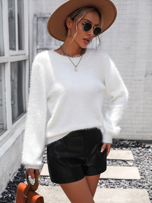 White fluffy knit sweater with lace back detail, crew neck, and long sleeves.