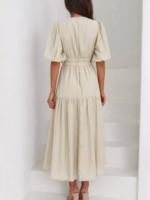 Elegant Puff Sleeve V-neck Midi Dress in Black, model styling view
