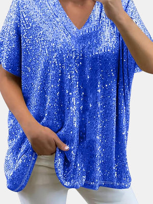 Blue sequin slouchy v-neck top with short sleeves and a relaxed fit.