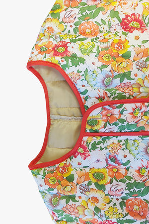 Floral quilted jacket with contrast piping and a beige lining.