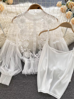 White lace embroidered blouse with sheer puff sleeves and matching cami.