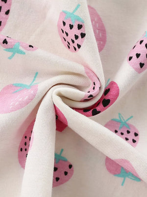 Toddler cotton dress with allover pink strawberry print and ruffled trim detail.