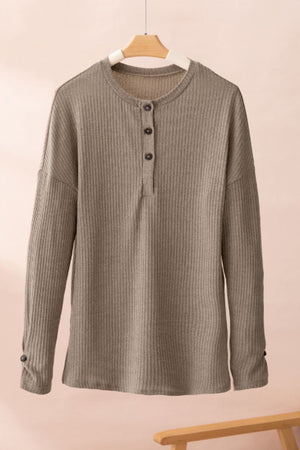 Khaki ribbed knit henley top with button detail and long sleeves.