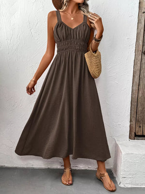 Coffee brown smocked V-neck midi dress with a flowy skirt and spaghetti straps.