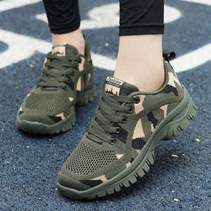 Camouflage mesh performance trainers in moss green with lace-up closure and athletic sole.