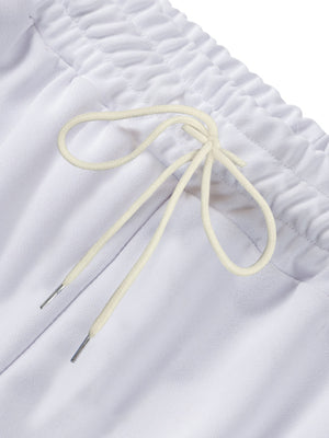 White track pants with drawstring and metal-tipped ends, elastic waistband detail