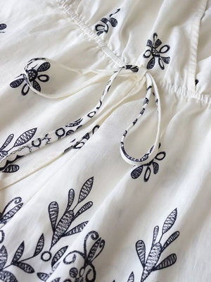 Printed Surplice Half Sleeve Romper in White, fabric detail