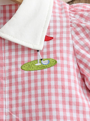 Baby pink gingham cotton polo dress with white collar and golf embroidery detail.