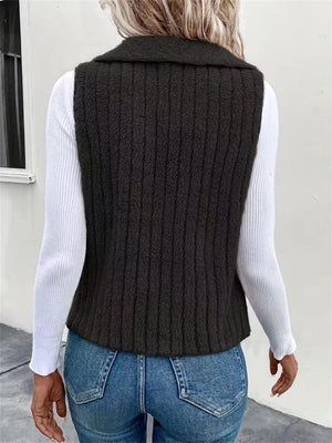 Textured teddy collarless vest in black with vertical ribbing detail.